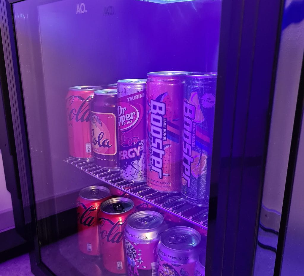 Minifridge filled with Coca-Cola and Dr. Pepper in gaming room